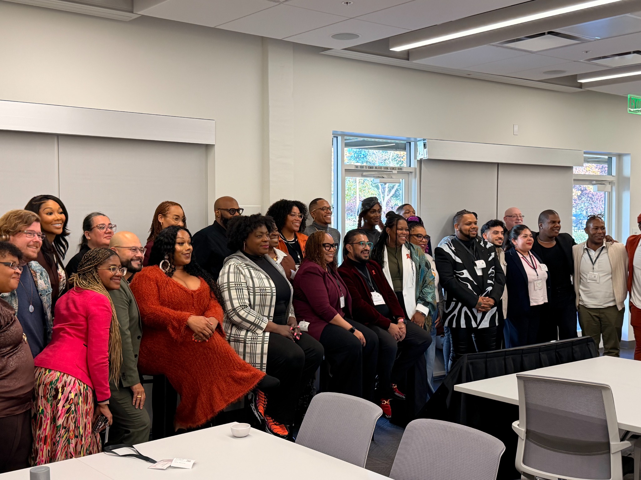 A diverse group gathered together in a community-centered setting
