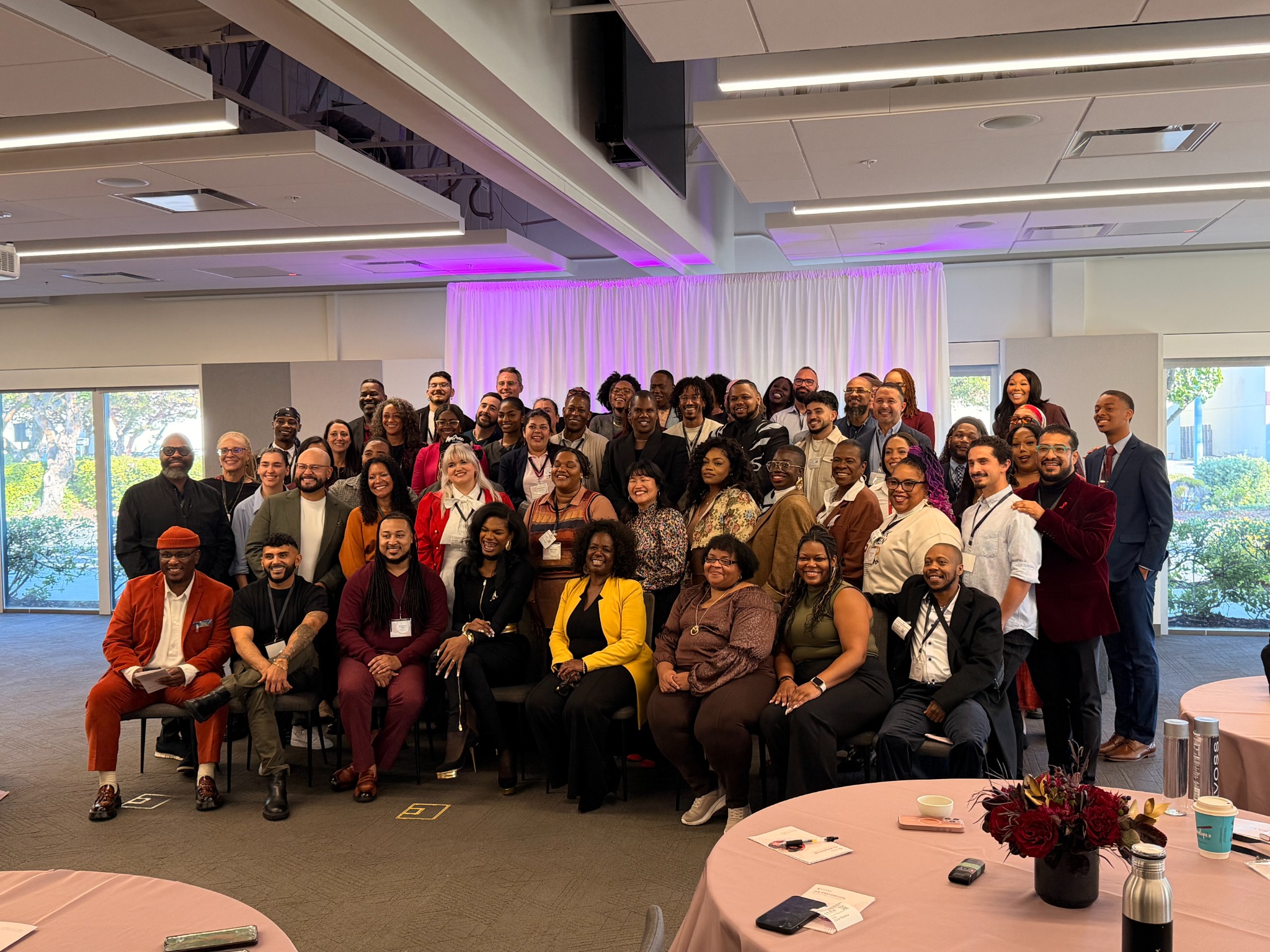 A diverse group of community and health leaders gathered together
